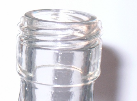 Glass bottle finish defect.